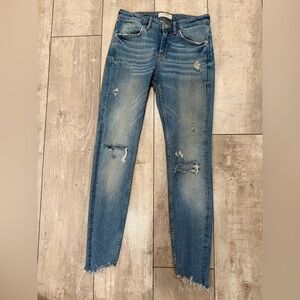 Women's Distressed Blue Jeans